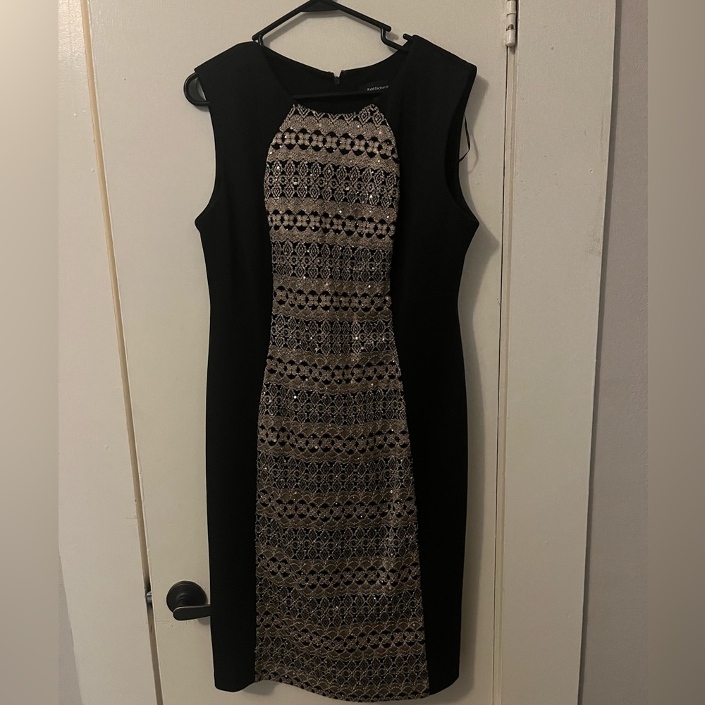 Black don’t con cocktail dress with gold detailing. Solid black back.
